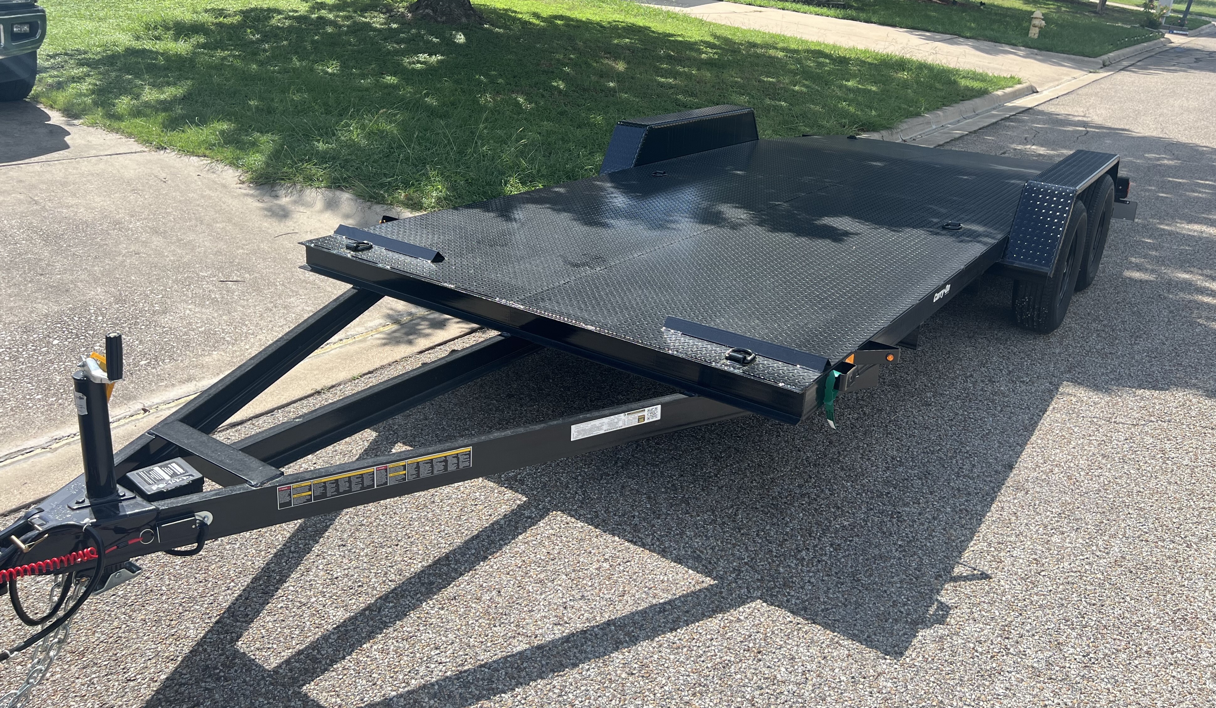 18-foot flatbed car hauler trailer with dovetail design and slide-out ramps for vehicle transport