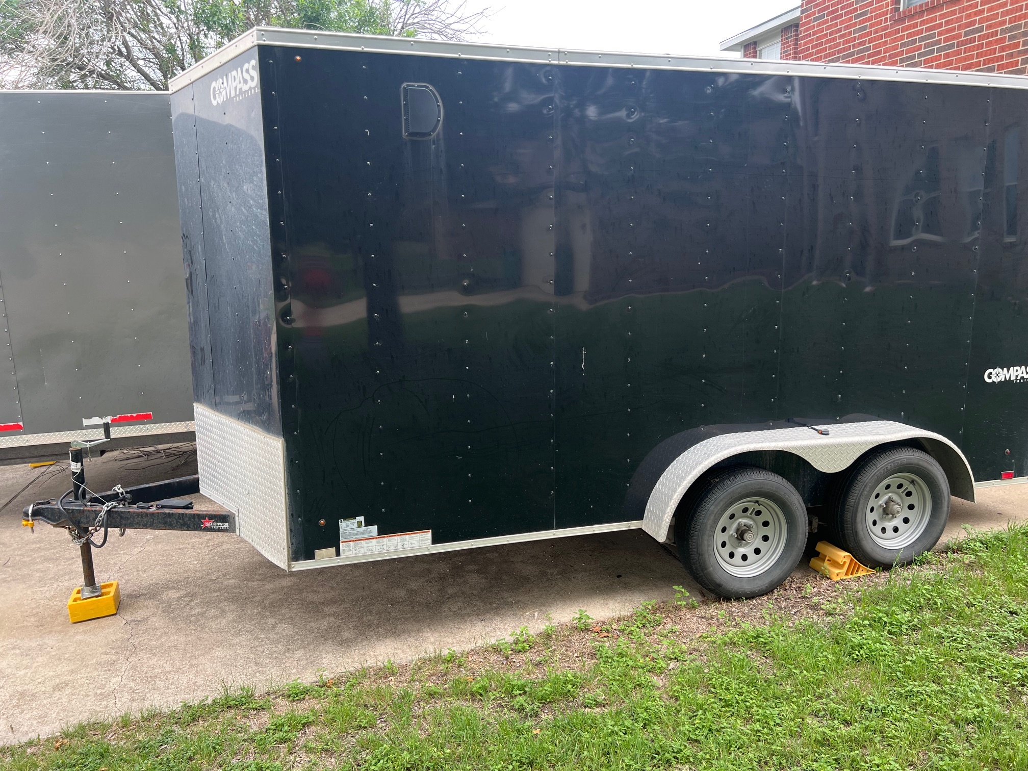 14x7 Compass enclosed cargo trailer with V-nose design for moving and storage